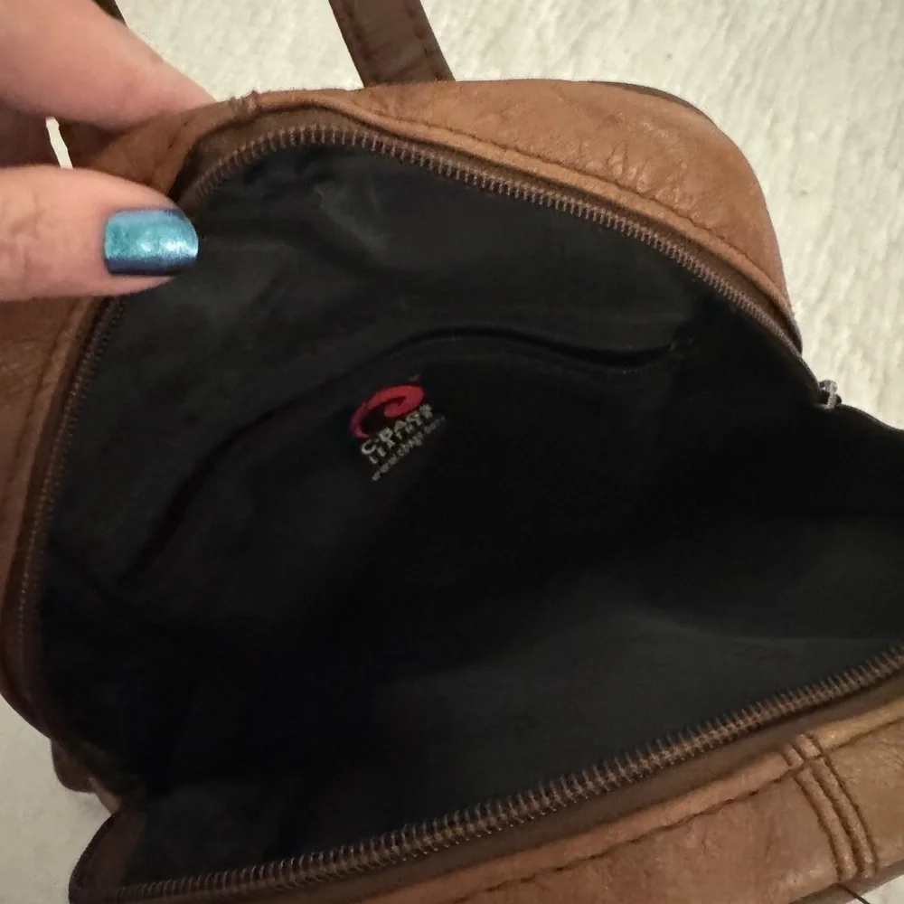 C bags leather backpack can also be shoulder bag. Tan